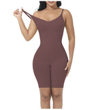 Woman wearing a brown bodysuit against a white background