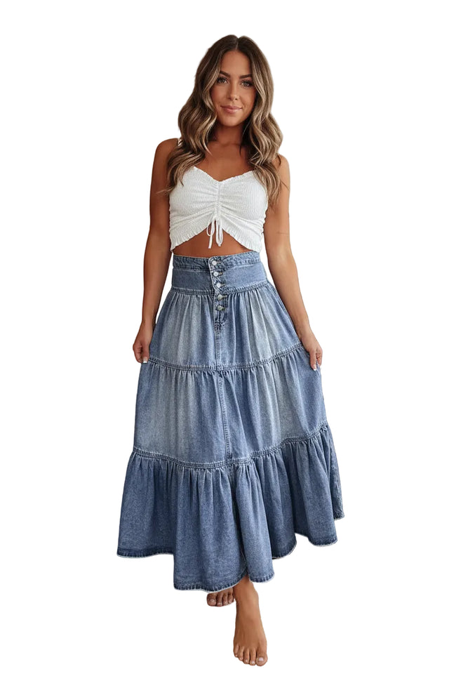 Denim skirt worn by a person indoors with wooden wall and cacti in the background