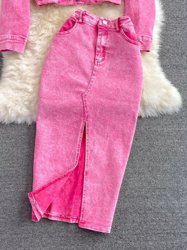 Pink jeans on a gray surface with a fluffy white rug in the background