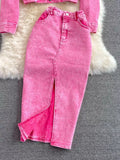 Pink jeans on a gray surface with a fluffy white rug in the background