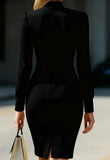 Person wearing a black suit with a blurred background