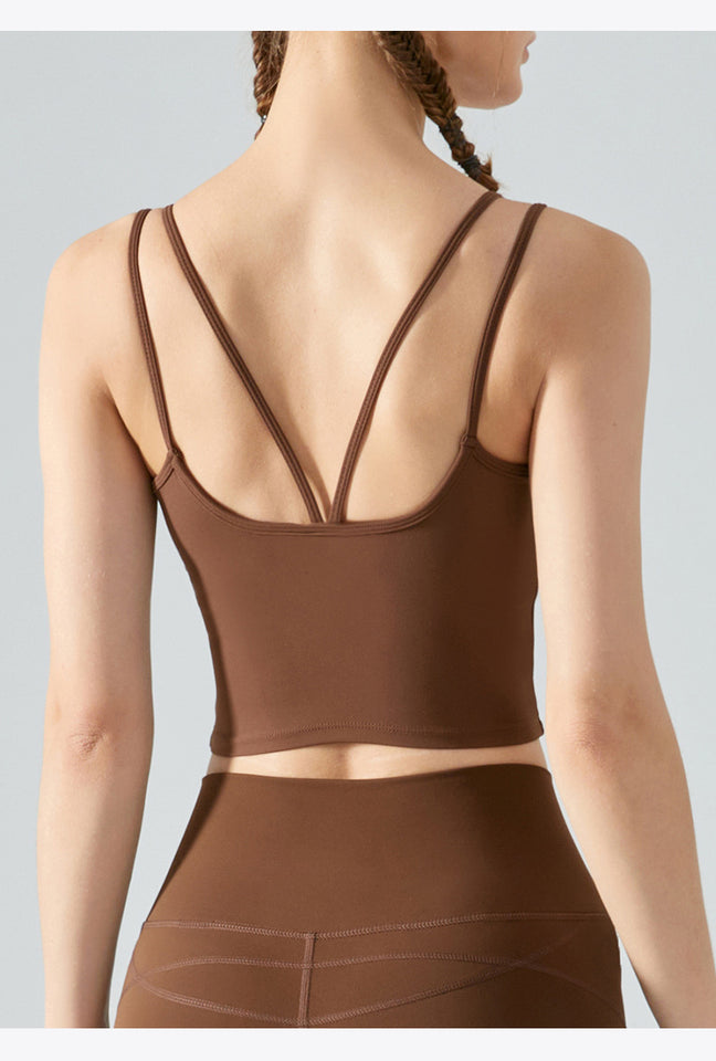 Brown sports bra and leggings set on a plain background