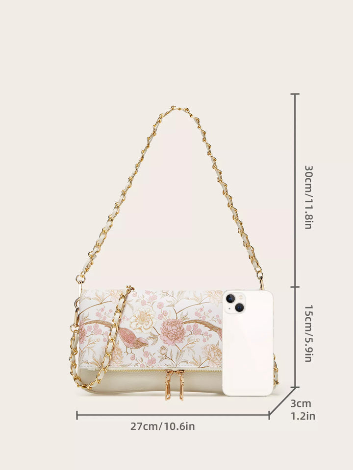 Floral handbag with chain strap and dimensions on a white background