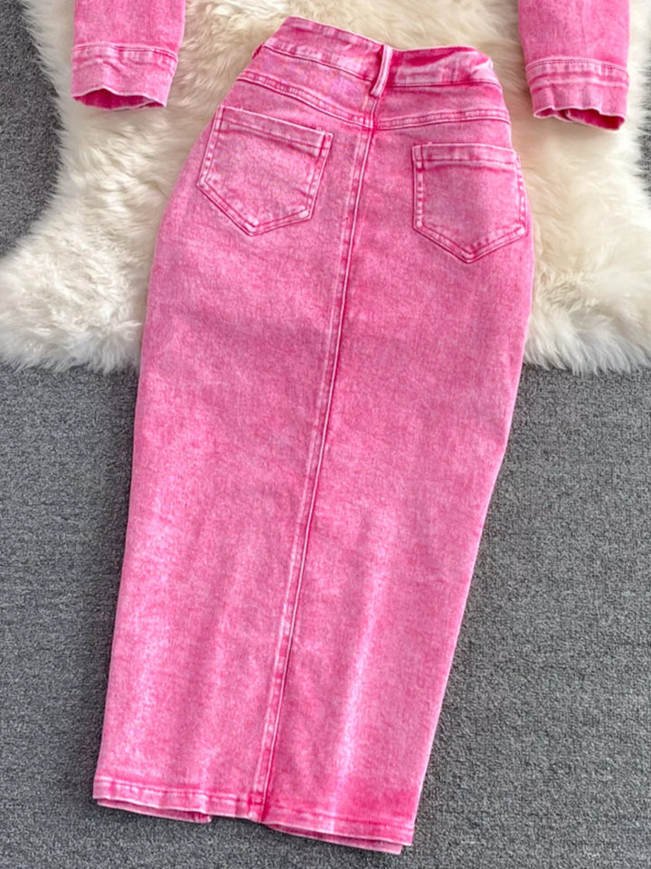 Pink denim skirt on a gray surface with a fluffy white rug in the background
