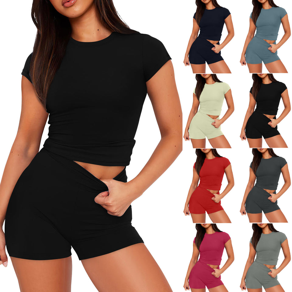 Woman wearing a black outfit with multiple color options displayed around her.