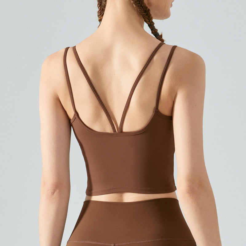 Brown sports bra and leggings on a plain background